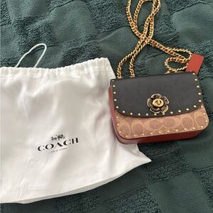 Coach Black and Tan Crossbody Bag with Gold Accents